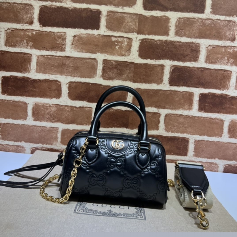 G*u*i top handle bags